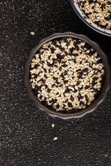 Sesame spice mix white and black tasty fresh gourmet food background on table rustic food top view copy space