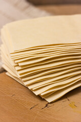 Fresh Lasagna Sheets on a Rustic Kitchen Table, Traditional Italian Cuisine