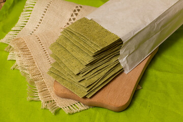 Fresh Green Lasagna Sheets on a Rustic Kitchen Table, Traditional Italian Cuisine