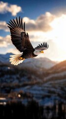 Obraz premium Majestic Bald Eagle in Flight Over Mountain Range Against Dramatic Sky Landscape Photography