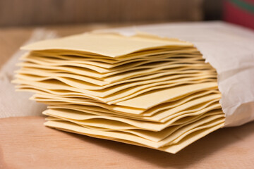 Fresh Lasagna Sheets on a Rustic Kitchen Table, Traditional Italian Cuisine