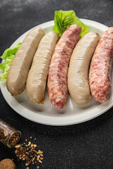 Sausages raw meat pork, beef, chicken, lamb fresh tasty food dish gourmet food background on the table rustic food top view copy space