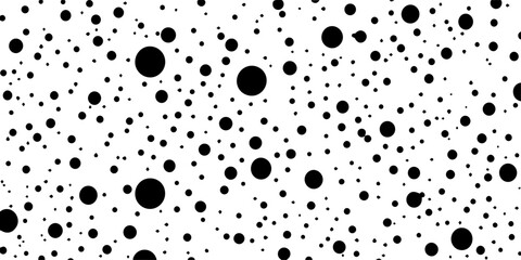 dense polka dot seamless pattern with various black circles on white background