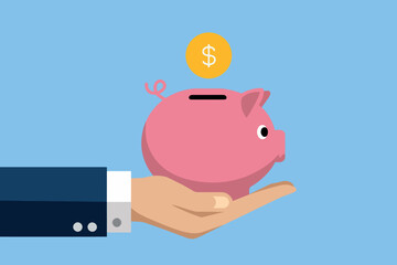 Businessman hand holding pink piggy bank, business and savings concept