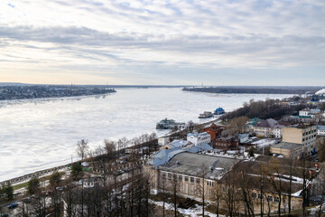 view of river embankment and piers in Kostroma