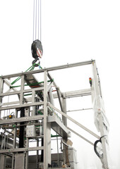 Loading with a crane a new machine for the production of medicines.