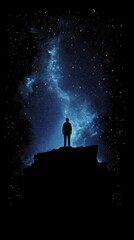 Fototapeta premium A solitary figure gazes at the vast expanse of the cosmos