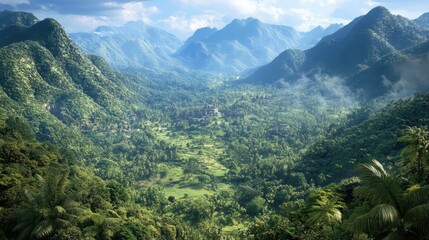 Fototapeta premium Lush green valley and surrounding mountains under a blue sky