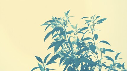 Naklejka premium Green leafy plant branches against a soft yellow background