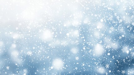 Obraz premium Snowflakes drift gently from the sky, creating a tranquil winter landscape. A soft blue background enhances the peaceful feel of the snow-covered scene