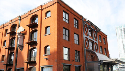 Industrial style building facade with red bricks 