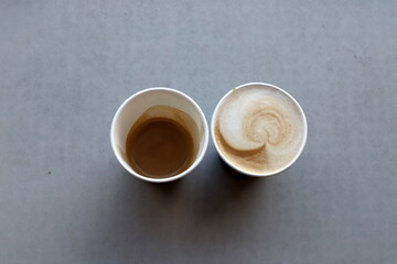 A cup of hot coffee on a table in a coffee shop