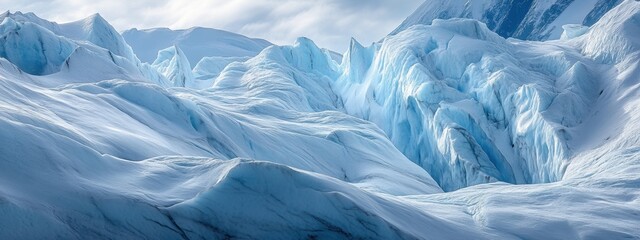 Glacier flow showcases the beauty of ice formations, revealing deep cracks and layered snow in a vast cold landscape