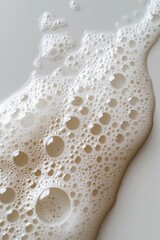 Obraz premium Abstract Soap Bubble Foam Texture on White Surface Close Up Gentle Cleansing Concept for Beauty and Hygiene Products Minimalist Aesthetic Background