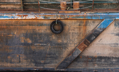 Detailed view of an aged ship hull with rusted sections