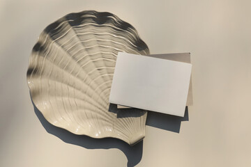 Summer stationery still life. Horizontal blank greeting card, invitation mock up scene. Oyster...