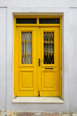 Yellow doors in the Old Town (Chora) of Ano Koufonisi. Small Cyclades, Greece