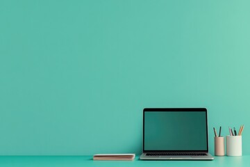neatly arranged desk setup with laptop and stationery on smooth solid color background