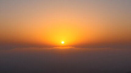 Fototapeta premium Stunning Sunset Over Foggy Landscape Aerial View
