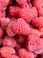 Close-up of fresh ripe raspberries with frost on their surface