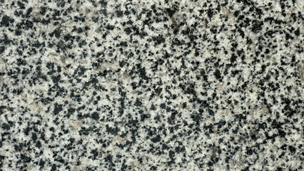 Texture of polished granite with black inclusions