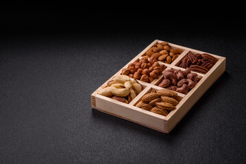 Wooden box with nuts cashew, hazelnut, almond, brazil, pecan, walnut