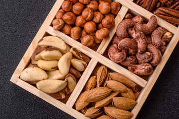 Wooden box with nuts cashew, hazelnut, almond, brazil, pecan, walnut