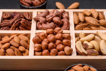 Wooden box with nuts cashew, hazelnut, almond, brazil, pecan, walnut