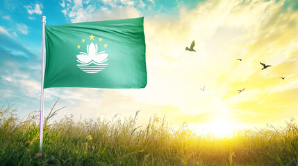 Macau flag textile cloth fabric waving on the top sunrise mist fog