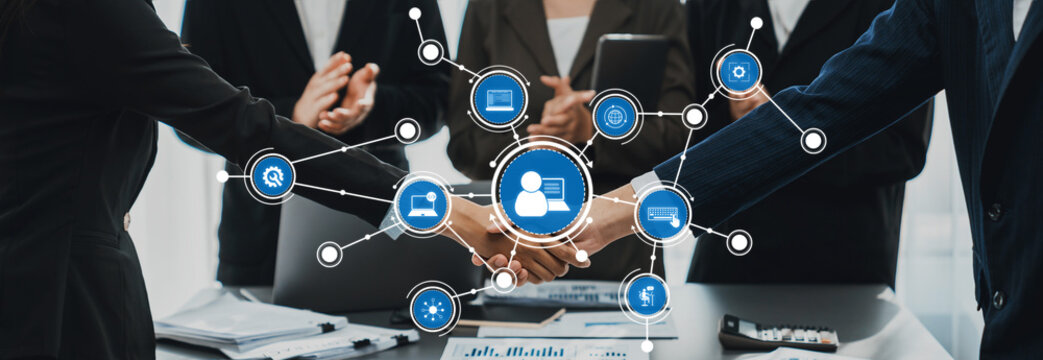 Business Collaboration and Networking Concept with Professional Team Shaking Hands Representing Successful Partnership and Digital Connectivity. Amity