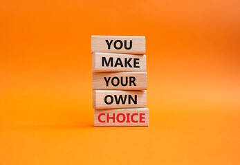 Make your Choice symbol. Concept words You Make your own Choice on wooden blocks. Beautiful orange background. Business and You Make your own Choice concept. Copy space.