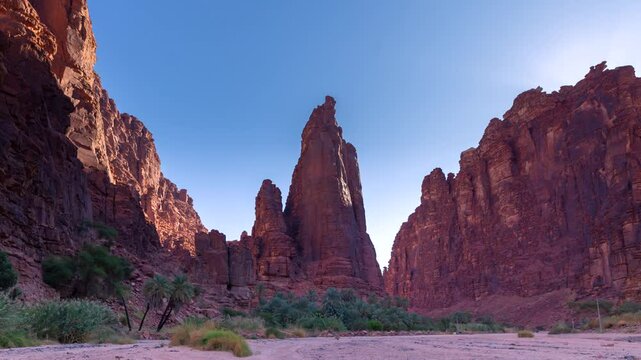 Time lapse of sunset sunrise in Wadi Disah, with beautiful rock and date tree in Tabuk,  Saudi Arabia.