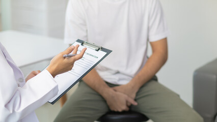 A young man suffering from erectile dysfunction seeks consultation with a specialist to identify the cause of his erectile dysfunction and seek treatment or cure for the erectile dysfunction.