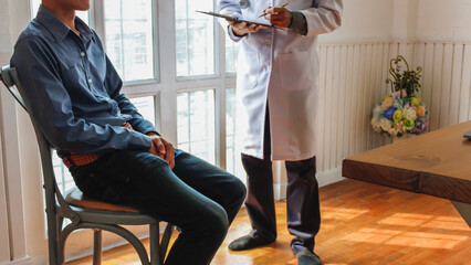 A young man suffering from erectile dysfunction seeks consultation with a specialist to identify the cause of his erectile dysfunction and seek treatment or cure for the erectile dysfunction.