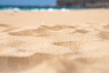Golden grains gently shift under the beach's warm sunlight at Stockeros1