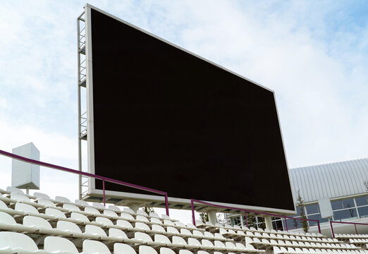 Large digital scoreboard at an outdoor athletics stadium