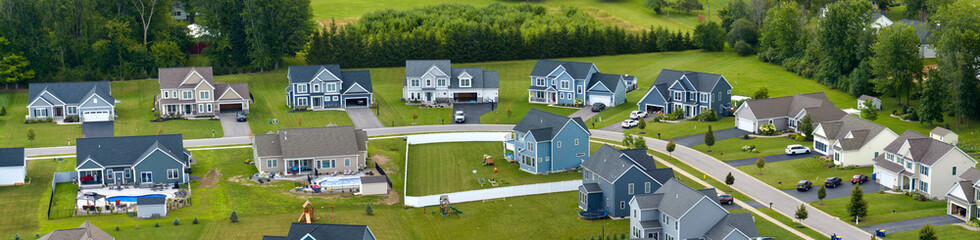 American dream homes as example of real estate development in US suburbs. View from above of...