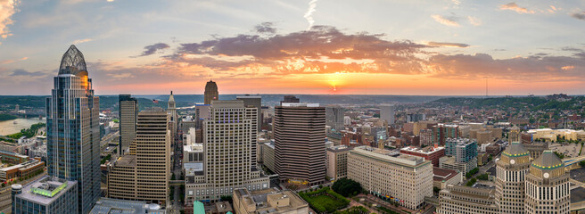 Fototapeta premium Cincinnati Ohio urban architecture in city downtown at sunset. Panoramic view of business district skyline with high-rise buildings at nightfall