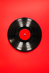 Obraz premium Vintage vinyl record on a solid red background