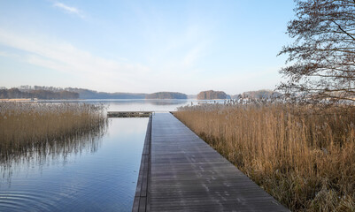 Wooden pier on Lake Barlinek, West Pomeranian Voivodeship, Poland.