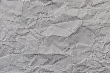 White recycled craft paper texture as background. Grey paper texture, Old vintage page or grunge vignette of old newspaper. Pattern rough art creased grunge letter. Hardboard with copy space for text.