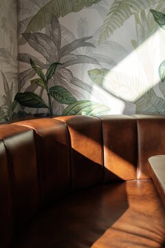 Warm sunlight casting on a tropical-themed restaurant interior