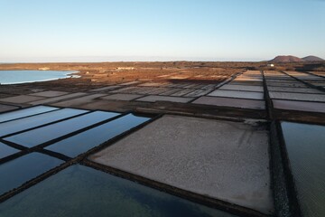 SALINAS DE JANUBIO salt flats on Lanzarote island, historic salt production site along volcanic...