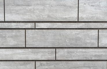 Gray rectangular wall tiles with thin seams