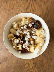 Cottage cheese bowl or curd cheese with banana, walnut and jam also called turkish lor peyniri