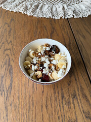 Cottage cheese bowl or curd cheese with banana, walnut and jam also called turkish lor peyniri
