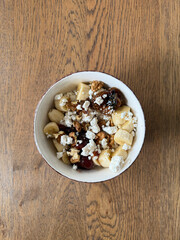 Cottage cheese bowl or curd cheese with banana, walnut and jam also called turkish lor peyniri