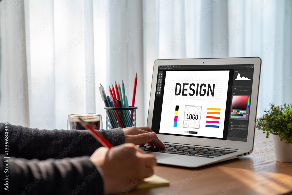 Wall mural graphic designer software for modern design of web page and commercial ads showing on the computer s