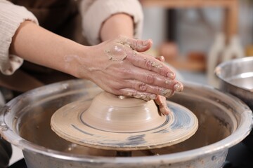 Hobby and craft. Woman making pottery indoors, closeup
