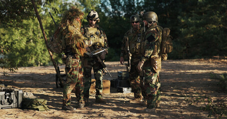 Soldiers of the territorial defense unit meet at the base, organizing tactics and planning...